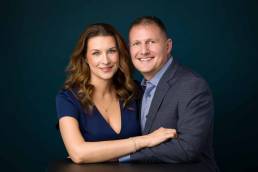 A Denver wife and husband sit for a studio portrait to celebrate their anniversary