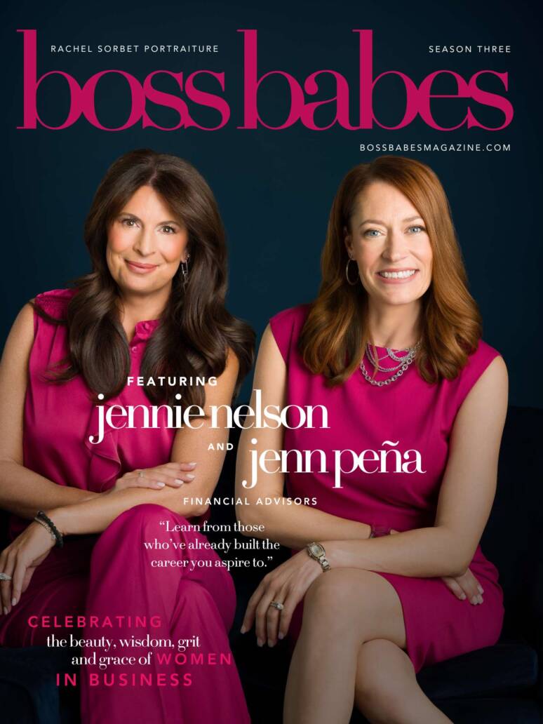 A portrait of two female financial advisors in Denver wearing hot pink suits