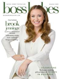 A portrait of Brook Jennings in an all white suit on the cover of Boss Babes Magazine