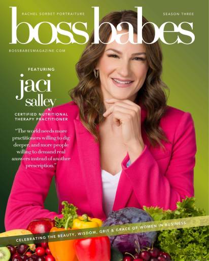 A portrait of nutritionist Jaci Salley sitting at a table with fruits and vegetables.